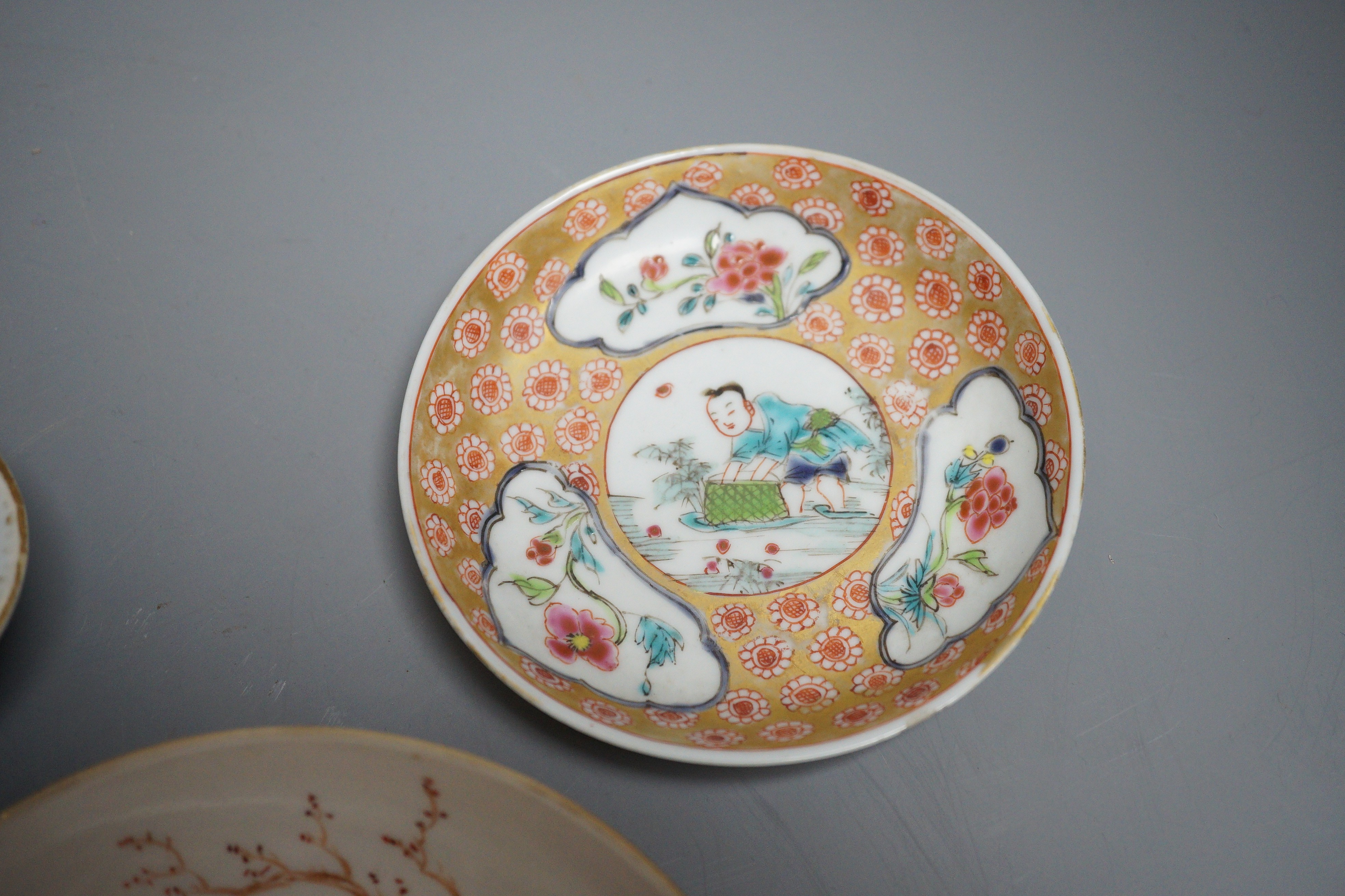 Two 18th century Chinese export saucers and two other later dishes, largest 13cm diameter